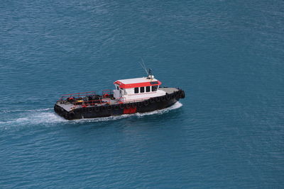 High angle view of ship sailing in sea