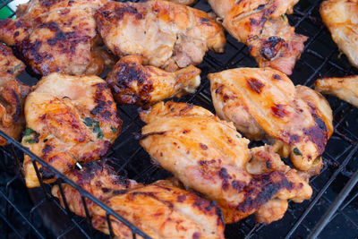 High angle view of meat on barbecue grill