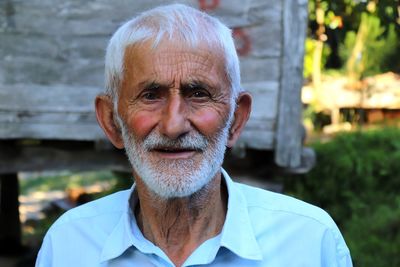 Close-up portrait of smiling senior man