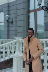 Man looking away while standing outdoors