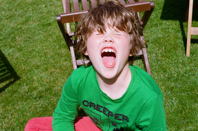 Portrait of boy wearing hat on grass