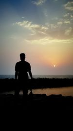 Silhouette of people on beach