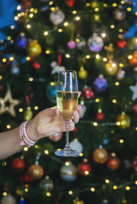 Cropped hand of woman holding wineglass