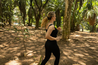 Woman running and jogging at a park outdoors. athlete female person during workout. healthy 