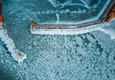 High angle view of cigarette in swimming pool