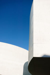 Low angle view of buildings against blue sky