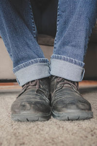 Low section of woman standing on ground