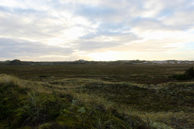 Scenic view of landscape against sky during sunset