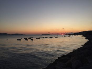 Scenic view of sea against clear sky during sunset