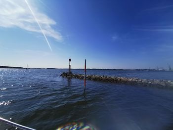 Scenic view of sea against blue sky