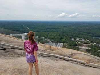 Rear view of woman looking at landscape