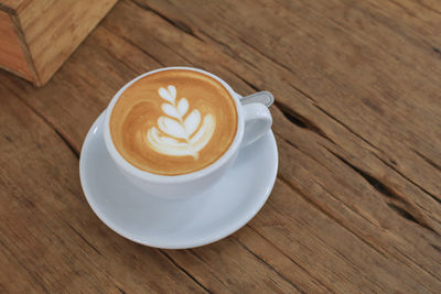 High angle view of cappuccino on table