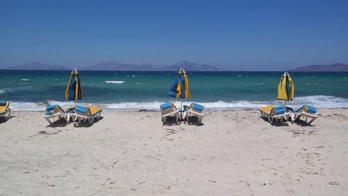 Panoramic view of beach against blue sky