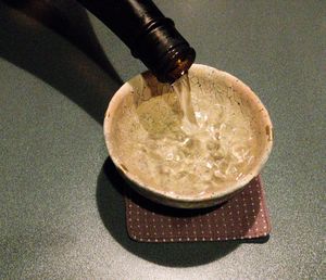 High angle view of drink in glass container on table