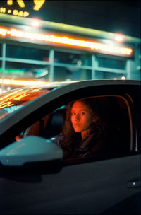 Reflection of woman in car