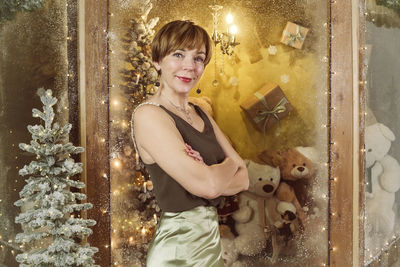 Portrait of young woman standing in store