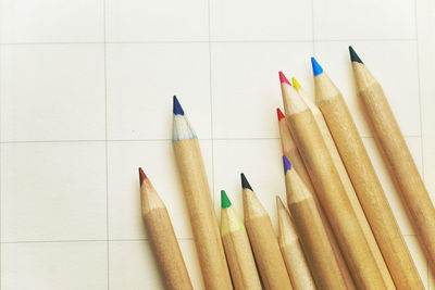 Close-up of colored pencils against white background