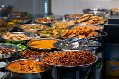 Asian dishes, economy rice or mixed rice stall. hawker food. selective focus