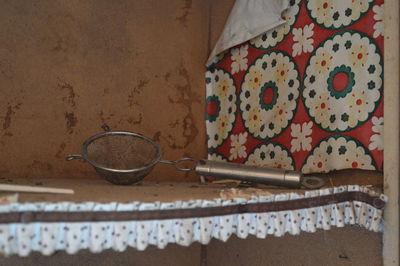 Close-up of strainer on table