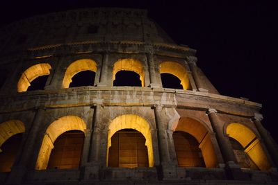 Low angle view of historical building at night