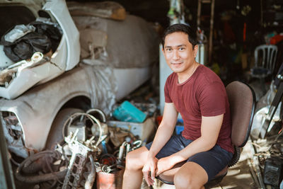 Portrait of young man sitting in car