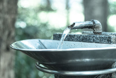 Water flowing from faucet at outdoors