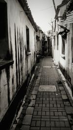 Narrow footpath along houses in old town