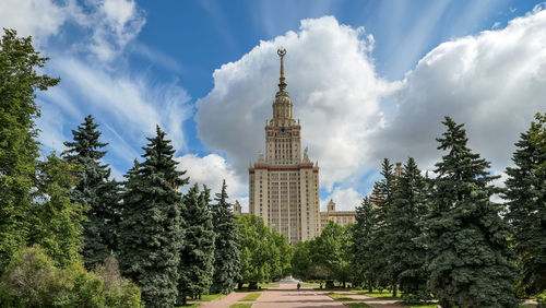 Large white cloud over green campus of moscow university
