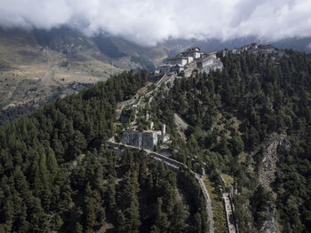 Panoramic view of trees and mountains against sky