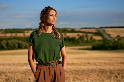 Young woman standing on field