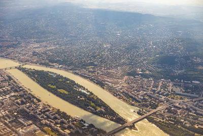 Aerial view of townscape and cityscape against sky