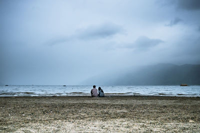 Scenic view of sea against cloudy sky