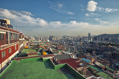 High angle view of buildings in city against sky