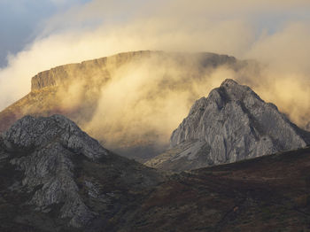 Scenic view of volcanic mountain against sky