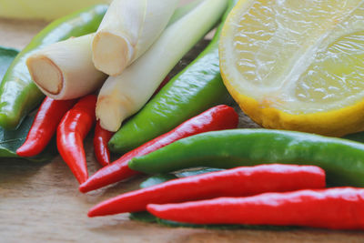 Close-up of red chili peppers on table