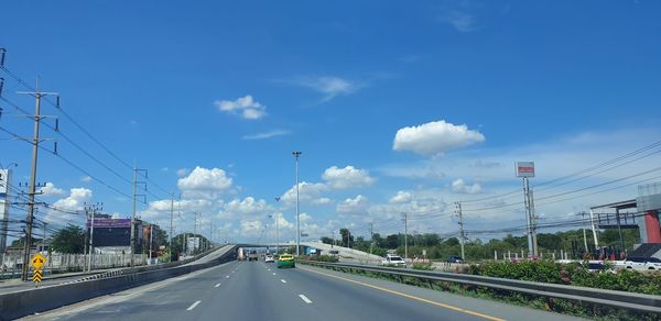 Road by highway against sky