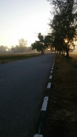 Empty road at sunset
