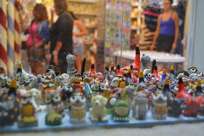 Various figurines displayed for sale in store