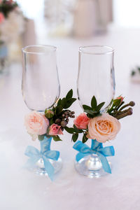 Wedding glasses on the table with decorations and flowers