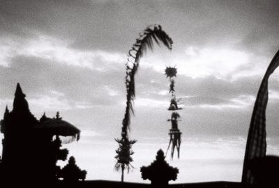 Low angle view of silhouette trees against sky at dusk