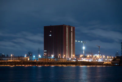 Illuminated city at waterfront