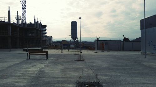 Buildings against cloudy sky