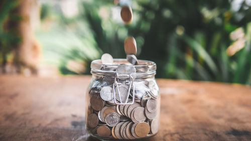 Close-up of candle in jar on table