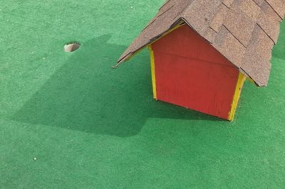 High angle view of playhouse on turf