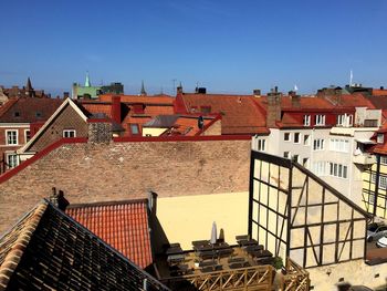 Houses in town against clear sky