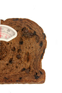 Close-up of cake against white background