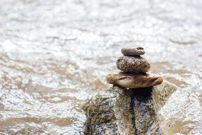 Close-up of stone stack on rock