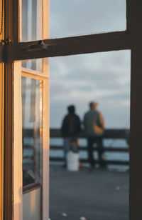 Silhouette of woman against sky