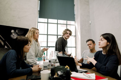 Business professionals discussing in office