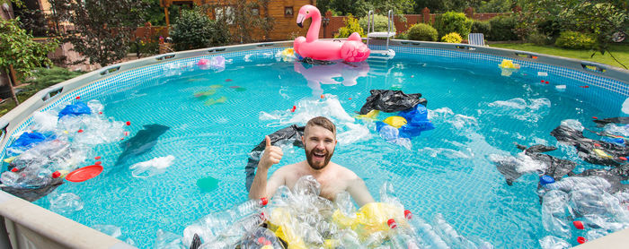 High angle view of man swimming in pool